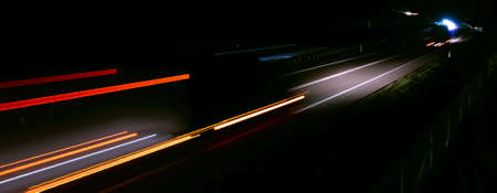 abstract red car lights at night. long exposureの写真素材