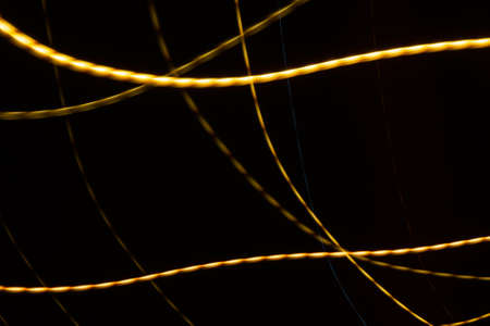 colored lines on a black background. texturaの写真素材