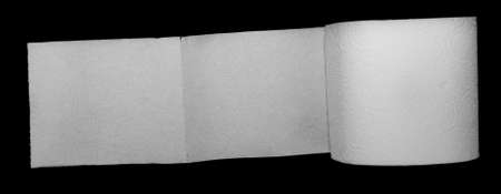 white toilet paper on a black isolated backgroundの写真素材