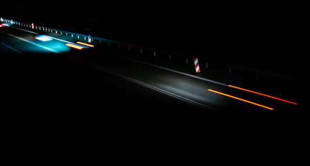 lights of moving cars at night. long exposure