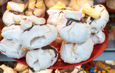 meringue cookies in a shop window. background
