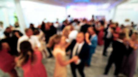 abstract blurry background with dancing people at the partyの写真素材