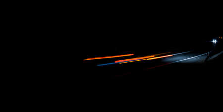 abstract red car lights at night. long exposureの写真素材