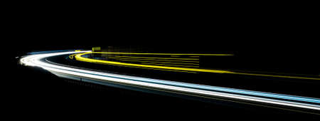 abstract yellow car lights at night. long exposureの写真素材