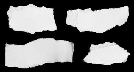 a white piece of paper on a black isolated backgroundの写真素材