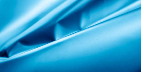 scratched blue metal sheet with visible texture. backgroundの写真素材