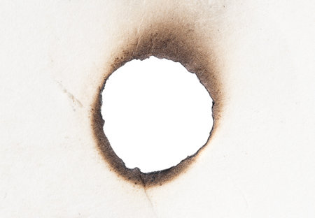 white burnt paper on white isolated backgroundの写真素材