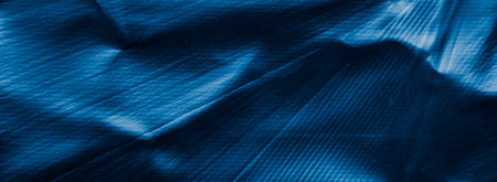 scratched blue metal sheet with visible texture. background