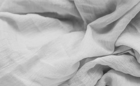 pleated white cotton material. texture or backgroundの写真素材