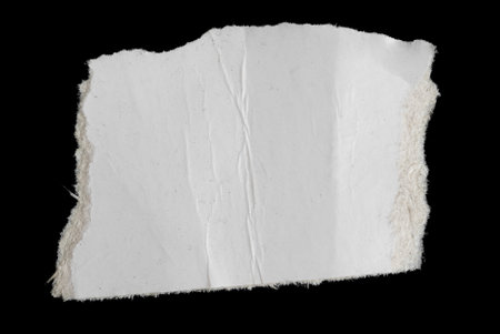 a white piece of paper on a black isolated background