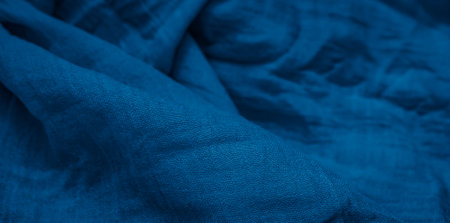 pleated blue cotton material. texture or backgroundの写真素材