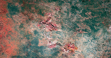 rusting old metal plate painted with green paint