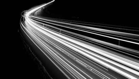 white lines of car lights on black background