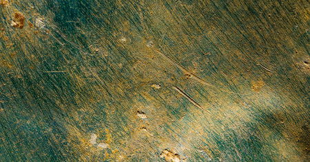 rusting old metal plate painted with green paint