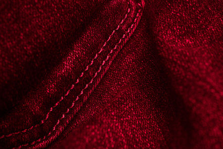 red jeans with a visible interesting texture. backgroundの写真素材