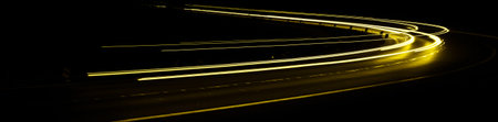 yellow car lights at night. long exposureの写真素材
