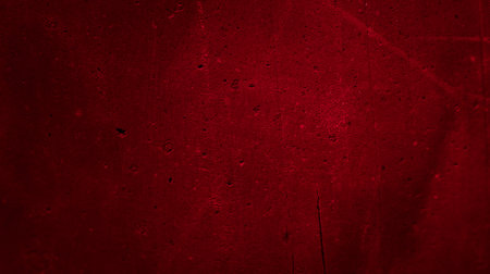 wall painted with red paint with an interesting textureの写真素材