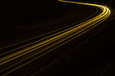 yellow car lights at night. long exposureの写真素材