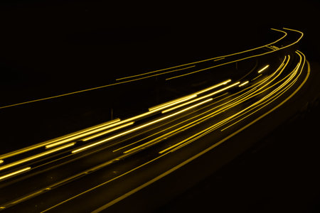 yellow car lights at night. long exposure