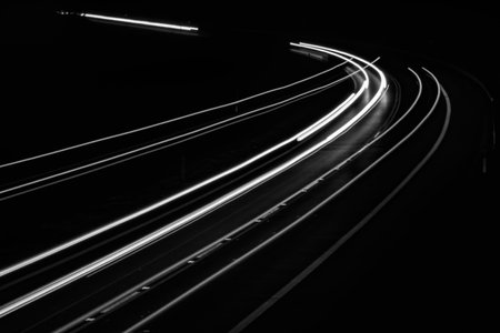 white lines of car lights on black backgroundの写真素材