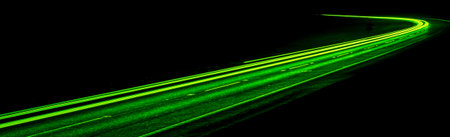 green car lights at night. long exposure