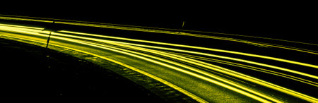yellow car lights at night. long exposureの写真素材