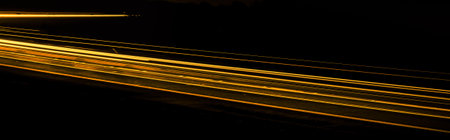 orange car lights at night. long exposureの写真素材