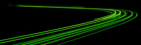 green car lights at night. long exposureの写真素材