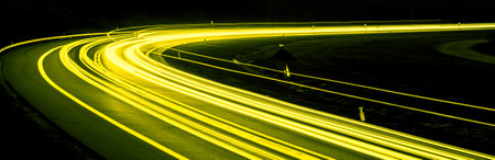 yellow car lights at night. long exposureの写真素材