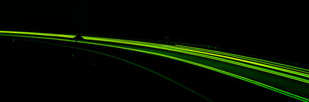 green car lights at night. long exposure