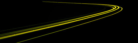 yellow car lights at night. long exposure