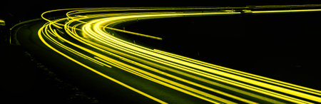 yellow car lights at night. long exposure