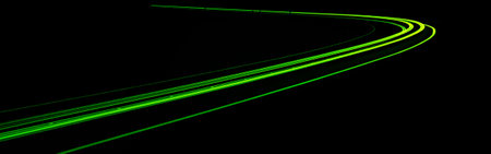green car lights at night. long exposure