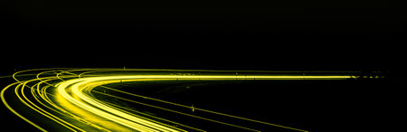 yellow car lights at night. long exposure