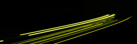 yellow car lights at night. long exposureの写真素材