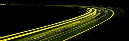 yellow car lights at night. long exposureの写真素材