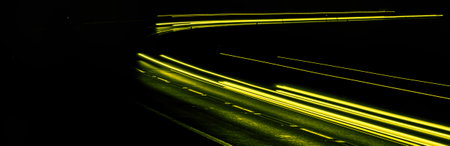 yellow car lights at night. long exposureの写真素材