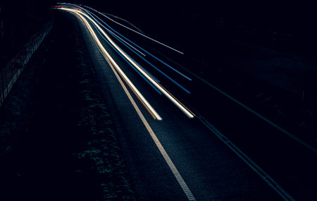 lights of cars driving at night. long exposure