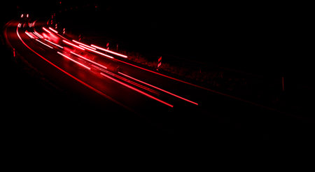 lights of cars driving at night. long exposure