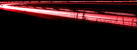 lights of cars driving at night. long exposure