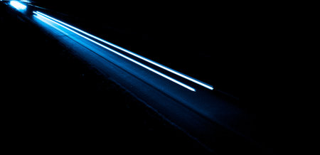 blue car lights at night. long exposure