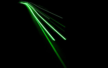 green car lights at night. long exposure