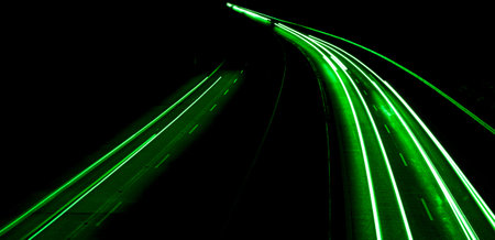 green car lights at night. long exposureの写真素材