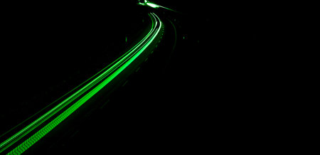 green car lights at night. long exposure
