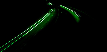 green car lights at night. long exposureの写真素材