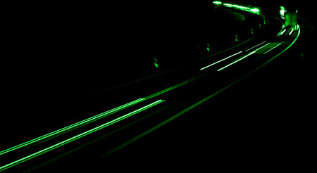 green car lights at night. long exposure