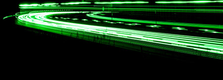 green car lights at night. long exposureの写真素材