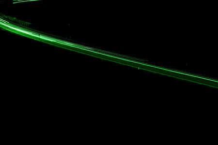 green car lights at night. long exposureの写真素材