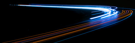 red car lights at night. long exposureの写真素材