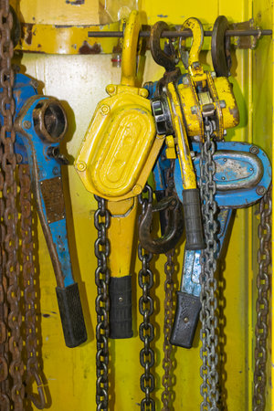 old yellow manual chain winchの写真素材